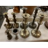 A COLLECTION OF SILVER PLATED AND PEWTER CANDLESTICKS