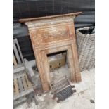 A LARGE VINTAGE CAST IRON FIRE SURROUND