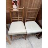 A PAIR OF OAK FRAMED BEDROOM CHAIRS WITH SPINDLE BACKS