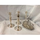FIVE SILVER PLATED ITEMS TO INCLUDE TWO PAIRS OF CANDLESTICKS AND A TOAST RACK