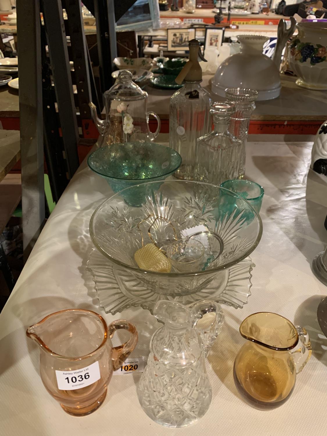 A SMALL SELECTION OF GLASS BOWLS, A DECANTER AND A GLASS TEAPOT WITH A FLORAL DISPLAY INSIDE