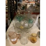 A SMALL SELECTION OF GLASS BOWLS, A DECANTER AND A GLASS TEAPOT WITH A FLORAL DISPLAY INSIDE