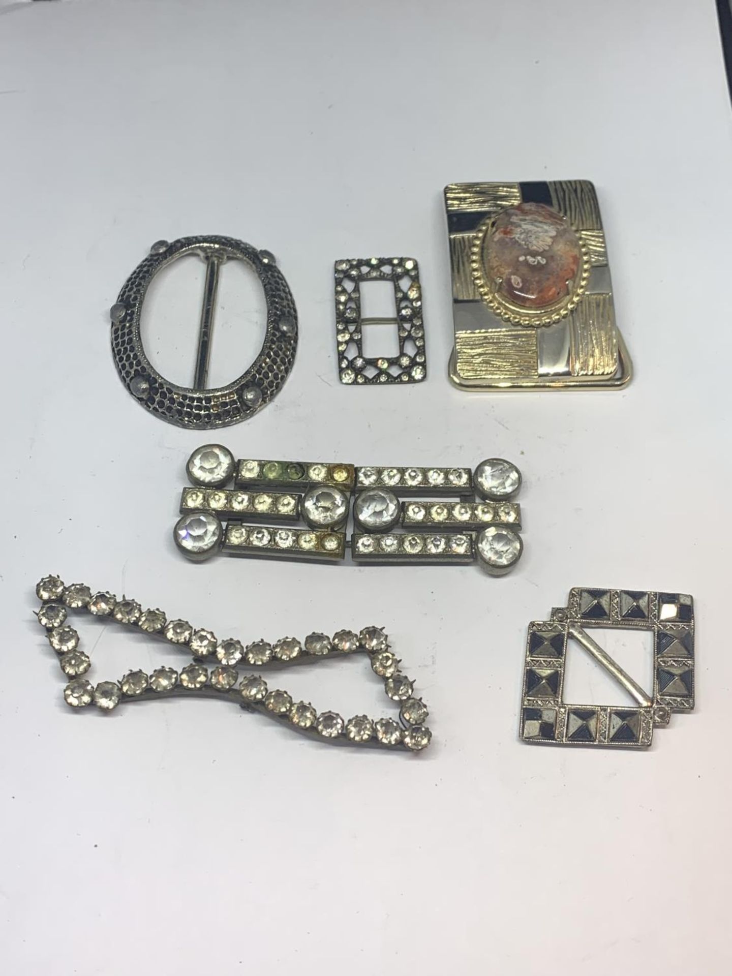 SIX VARIOUS DECORATIVE BUCKLES SOME WITH CLEAR STONES, ONE WITH AGATE ETC