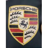 A CAST IRON PORSCHE SIGN