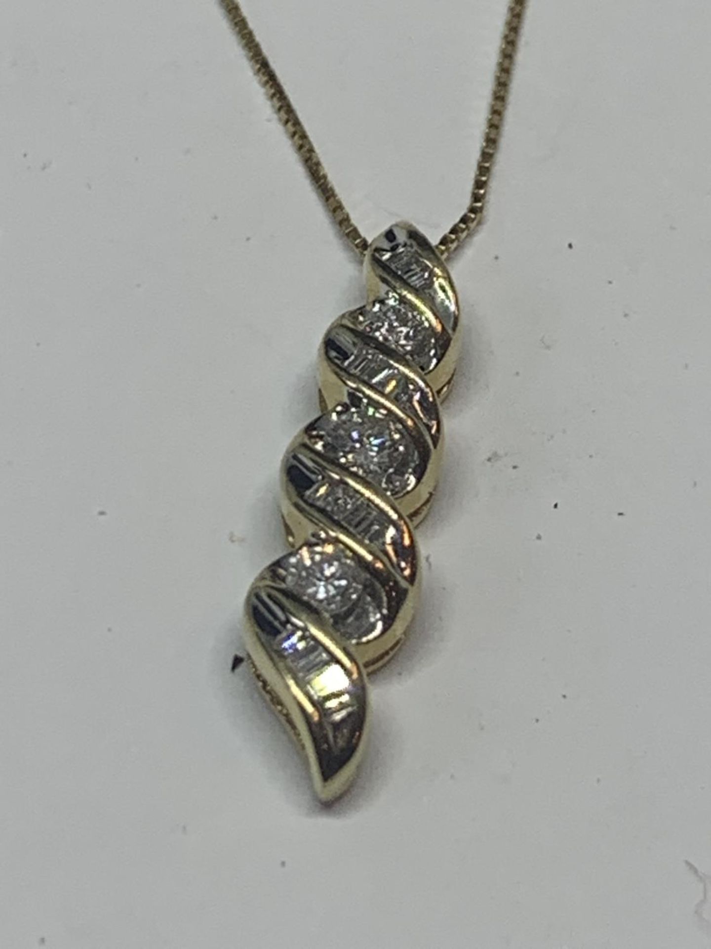 A 14 CARAT GOLD DROP PENDANT WITH APPROXIMATELY 1 CARAT OF DIAMONDS CHAIN LENGTH 45CM