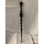 AN EBONISED WALKING CANE WITH BARLEY TWIST AND SNAKE CARVING