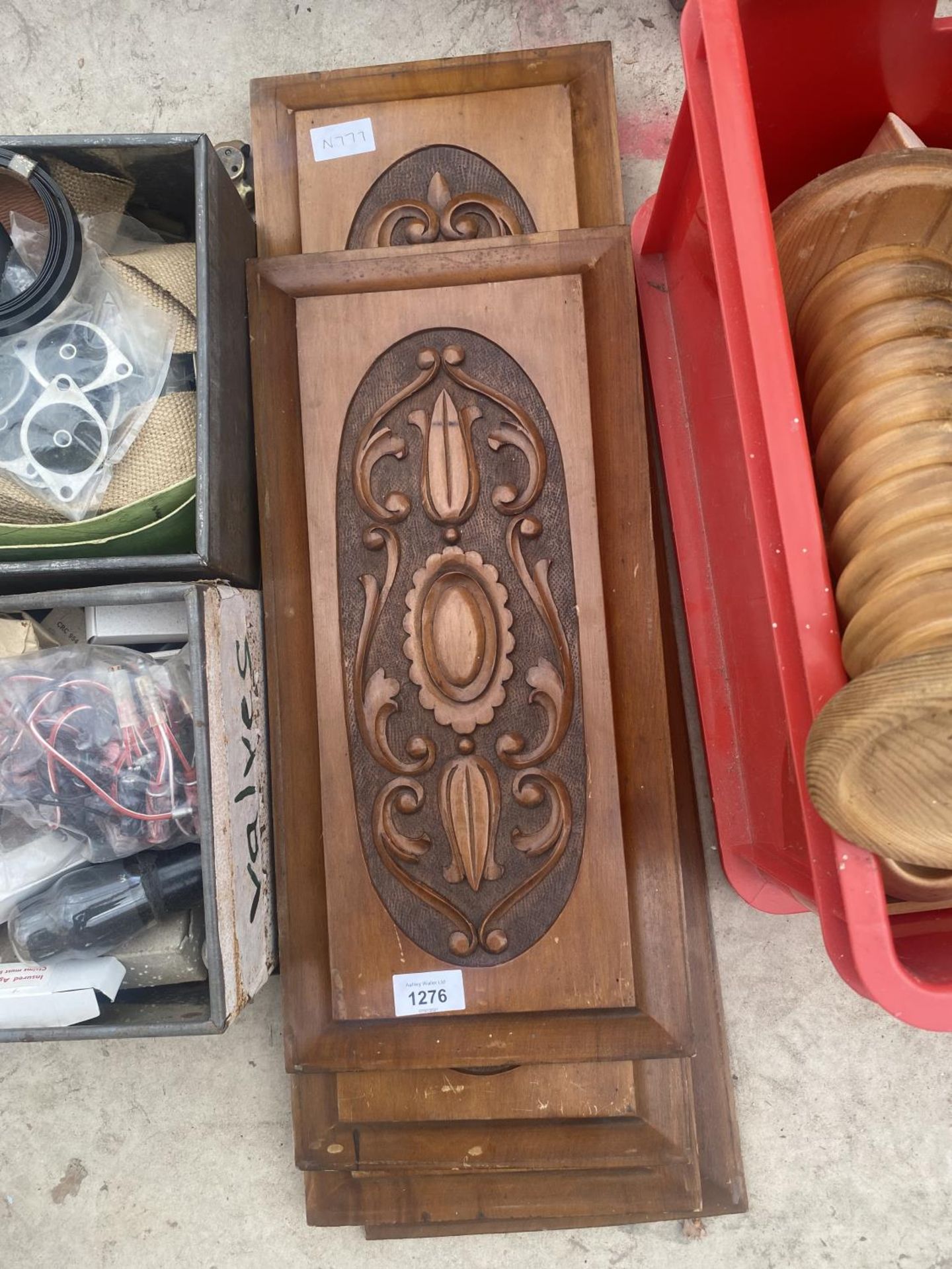 A GROUP OF FOUR VINTAGE AND DECORATIVE CARVED WOODEN PANELS