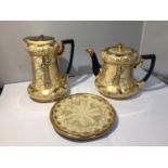 AN EARLY CREAM AND GILT TEAPOT, HOT WATER JUG AND STAND