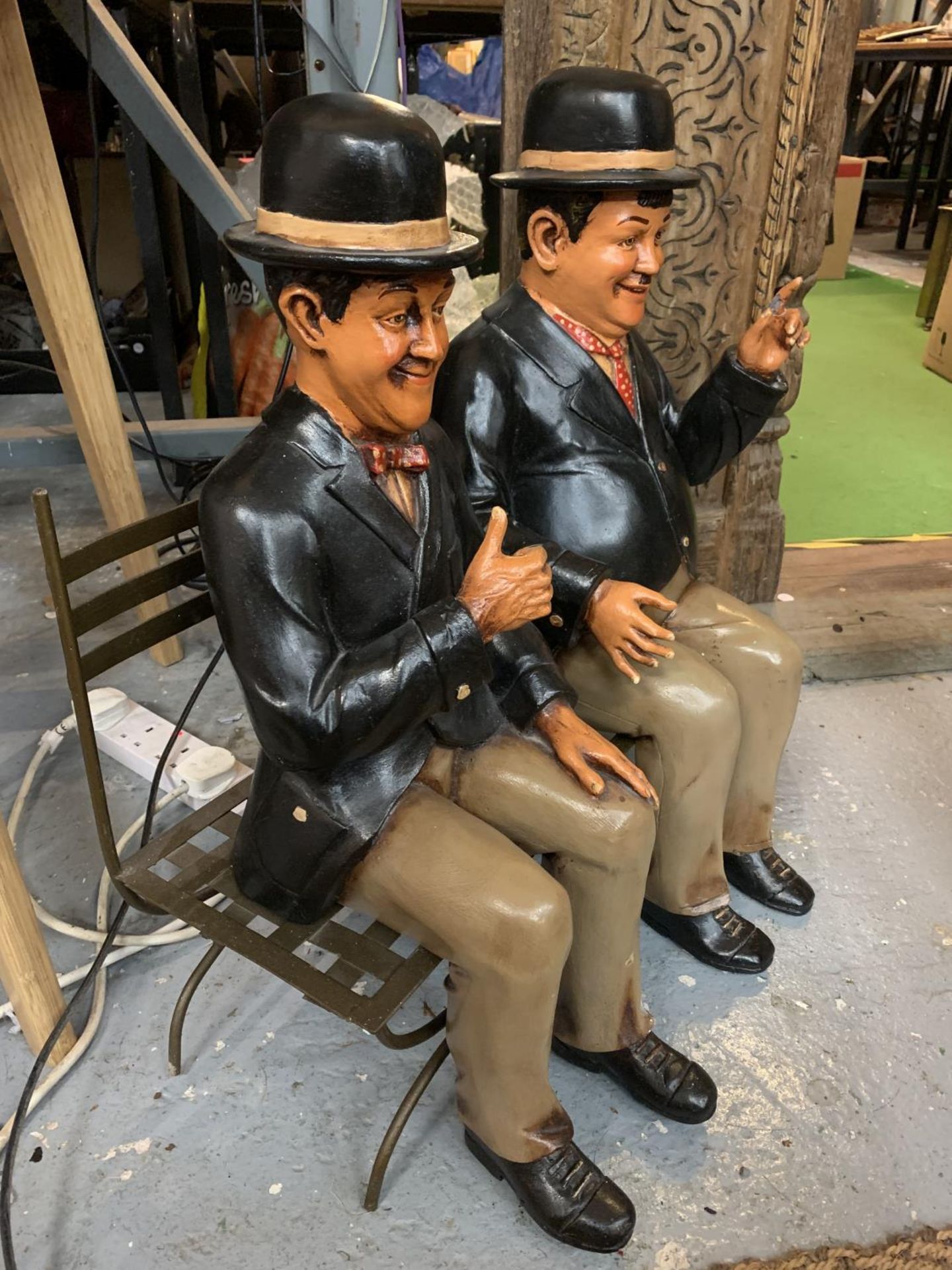 LARGE MODELS OF LAUREL AND HARDY SAT ON A CAST METAL SEAT - Image 2 of 3