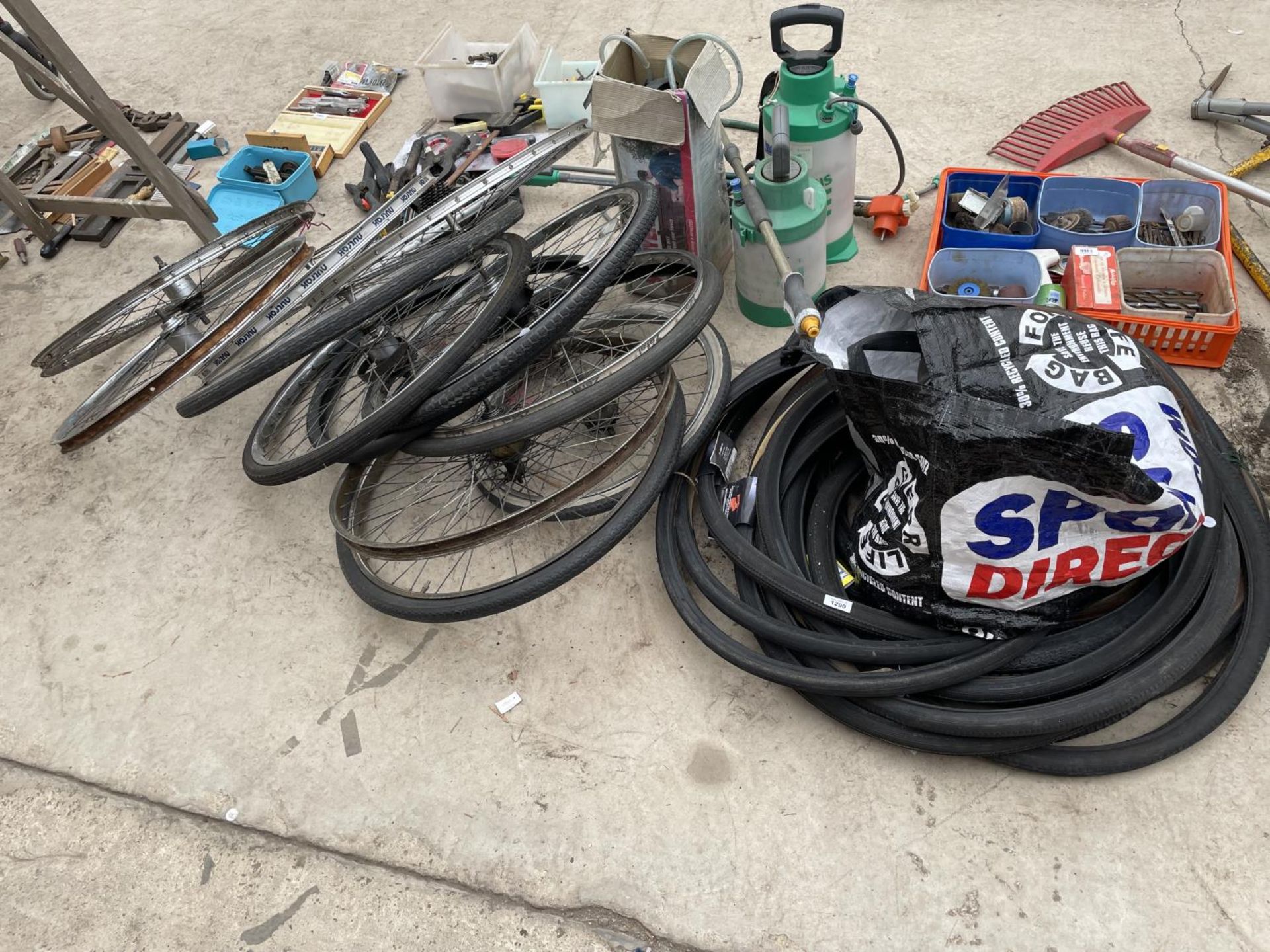 AN ASSORTMENT OF BIKE WHEELS AND A COLLECTION OF BIKE TYRES