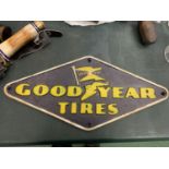 A CAST IRON GOODYEAR SIGN