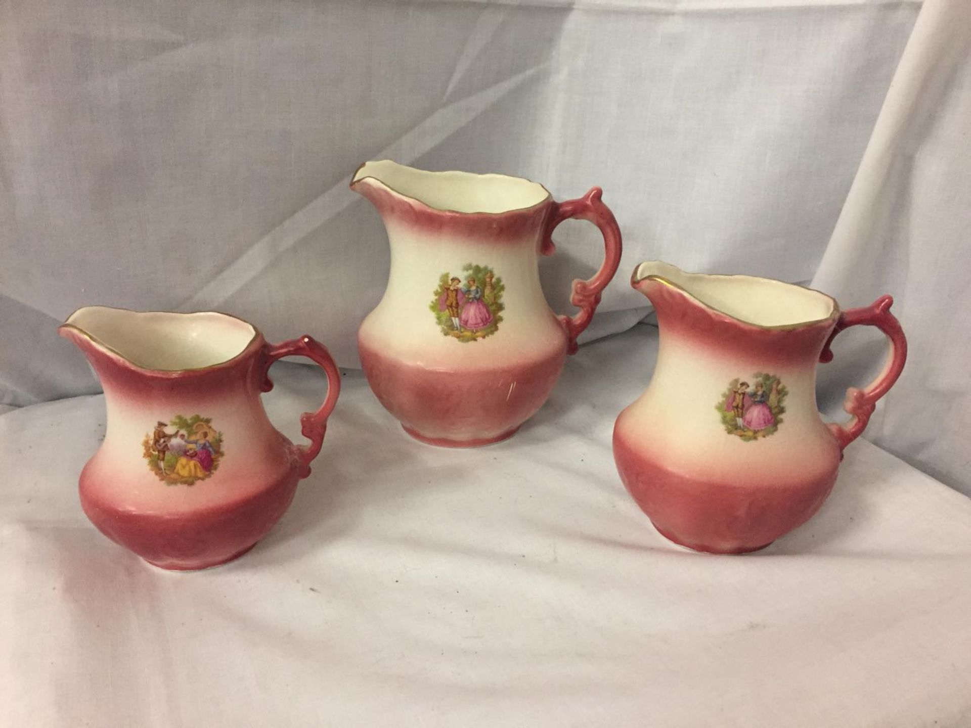 A COLLECTION OF THREE DECORATIVE JUGS