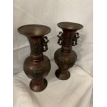 TWO DECORATIVE BRONZE URNS, ONE TOP NEEDS RE-AFFIXING, ONE MISSING HANDLE 38CM HIGH