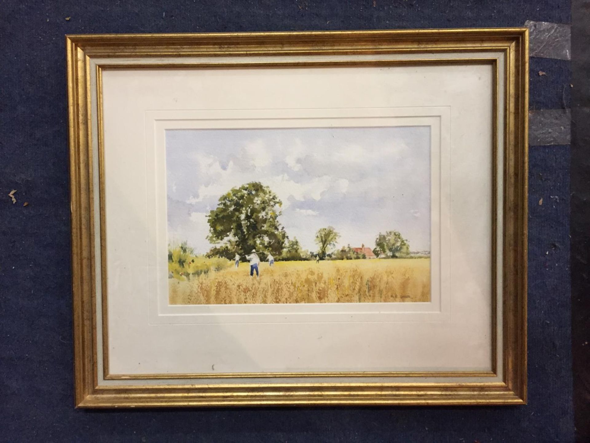 A GILT FRAMED WATER COLOUR OF A COUNTRY HARVEST SCENE PENCIL SIGNED M R ANKER TO RH CORNER