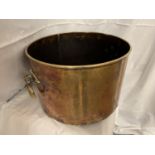 A VERY LARGE ARTS AND CRAFTS COPPER VESSEL WITH BRASS HANDLES, DIAMETER 35.5CM