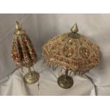 TWO METAL BASED HIGHLY DECORATIVE INDIAN ORNAMENTS IN THE STYLE OF UMBRELLAS WITH GEM, SEQUIN AND