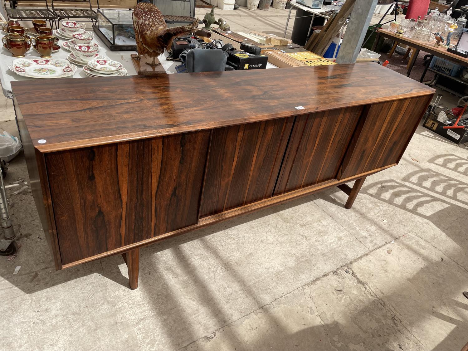 A RETRO HARDWOOD SIDEBOARD WITH FOUR SLIDING DOORS