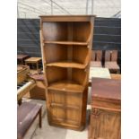 AN ERCOL OPEN CORNER CUPBOARD WITH CUPBOARDS TO THE BASE, 27" WIDE