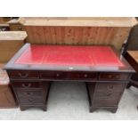 A REPRODUCTION MAHOGANY KNEEHOLE DESK OF NINE DRAWERS, 54X27"