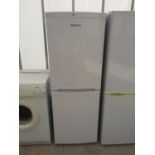 A WHITE BEKO UPRIGHT FRIDGE FREEZER BELIEVED IN WORKING ORDER BUT NO WARRANTY