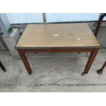 A RETRO TEAK EFFECT TWO TIER COFFEE TABLE ON WHEELS