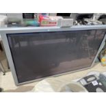 A 61" NEC TELEVISION WITH A HITATCHI SPEAKER