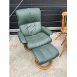 A GREEN STRESSLESS CHAIR AND STOOL