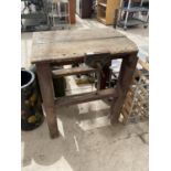 A SMALL VINTAGE WORK BENCH WITH SMALL PARAMO BENCH VICE