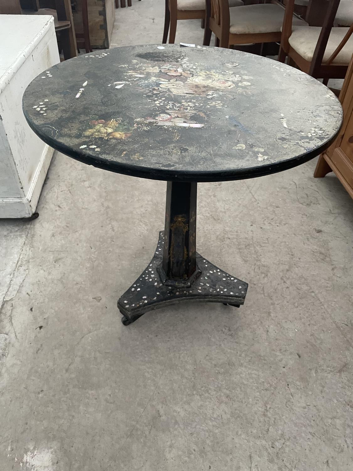 A VICTORIAN PAPIER MACHE TILT-TOP TABLE, PROFUSELY PAINTED WITH FLOWERS AND MOTHER OF PEARL INLAY,