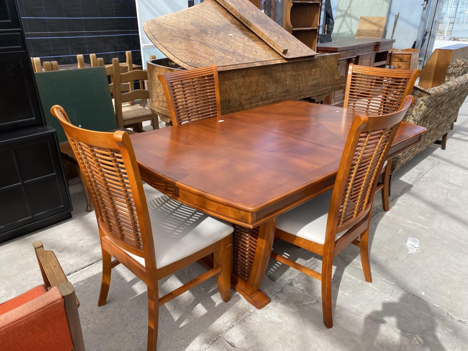 A MODERN YEW WOOD DINING TABLE, 64X42" AND SIX MATCHING CHAIRS WITH RATTAN BACKS