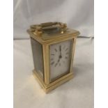 A SMALL CARRIAGE CLOCK