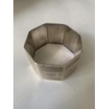 A MARKED STERLING SILVER NAPKIN RING ENGRAVED 22.7.46 WEIGHT 33 GRAMS