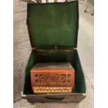 A VINTAGE BUTTON ACCORDIAN WITH CASE