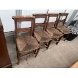 FOUR VICTORIAN BEECH FRAMED CHAPEL CHAIRS WITH RUSH SEATS