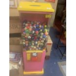 A CHILDRENS TOY BALL VENDING MACHINE WITH KEYS WITH OVER 400 BALLS