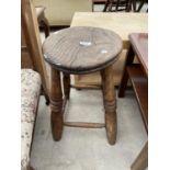 AN ELM VICTORIAN STOOL WITH FOUR TURNED LEGS