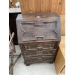 AN EARLY 20TH CENTURY OAK JACOBEAN STYLE BUREAU, 24" WIDE