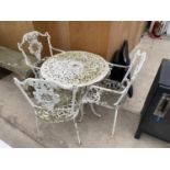 A CAST ALLOY BISTRO SET WITH ROUND TABLE AND THREE CHAIRS