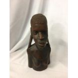 AN AFRICAN TRIBAL WOODEN CARVED BUST MODEL. H 30CM