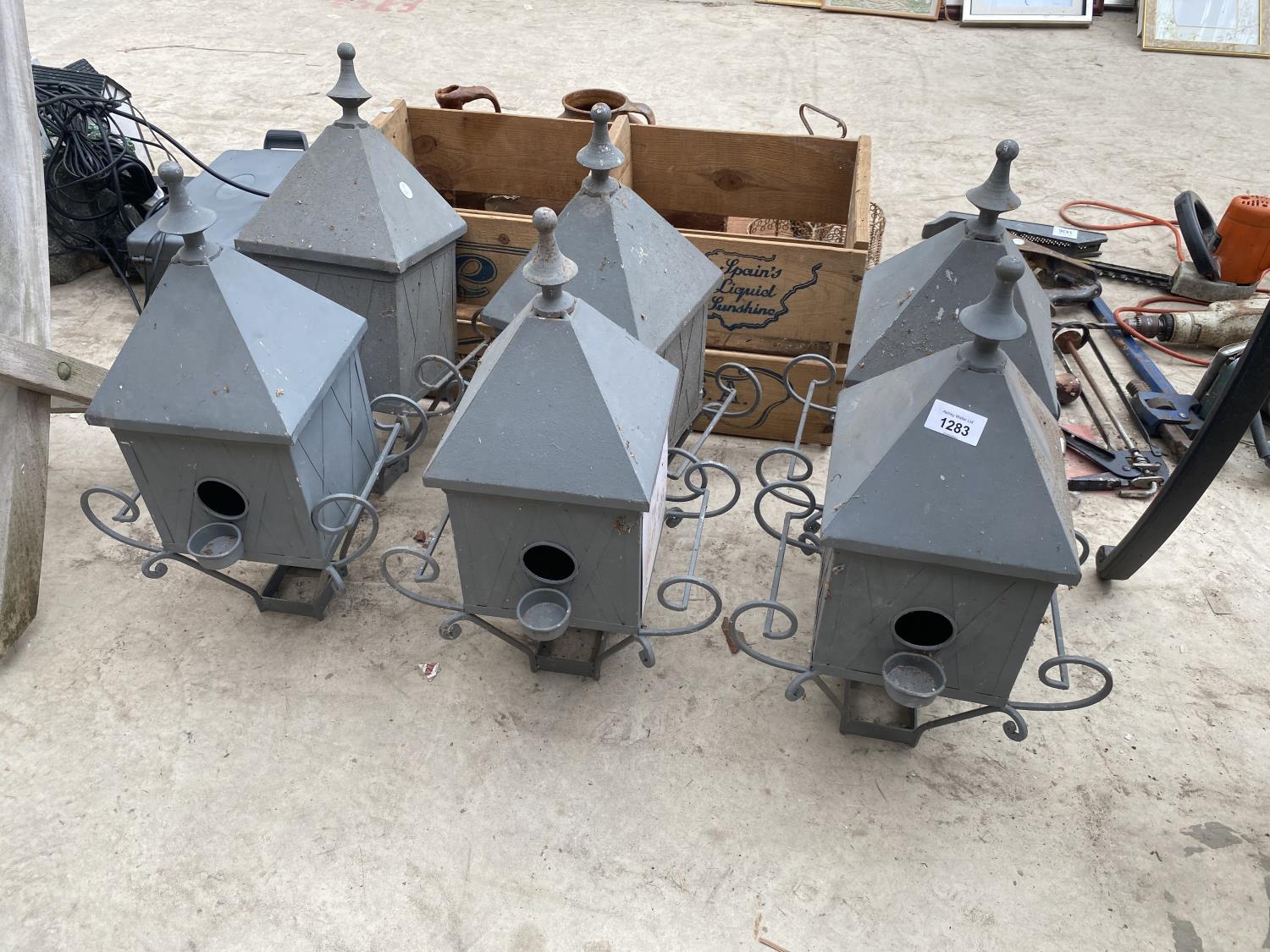 A GROUP OF SIX GOLF RELATED METAL BIRD BOXES