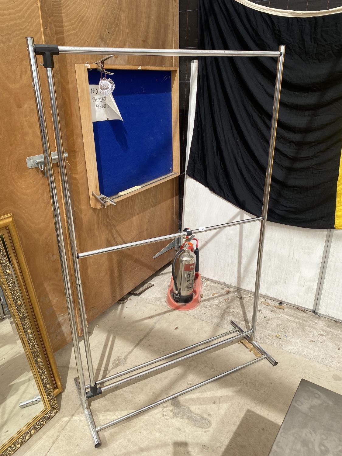 A STAINLESS STEEL TWO TIER CLOTHES RAIL