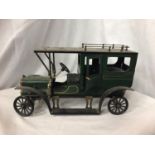 A VINTAGE STYLE MODEL GREEN MOTOR VEHICLE