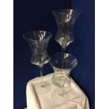 THREE LARGE GLASS CANDLE HOLDERS APPROXIMATE HEIGHTS 70CM 55CM 40CM