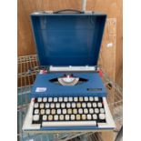 AN IMPERIAL 220 TYPE WRITER WITH CASE