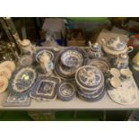 A LARGE ASSORTMENT OF BLUE AND WHITE DECORATIVE CERAMICS TO INCLUDE TEAPOTS, PLATES AND PLACE MATS