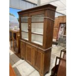 AN OAK BOOKCASE CABINET WITH TWO UPPER GLAZED DOORS AND THREE LOWER DOORS