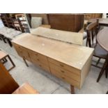 A RETRO TEAK SCHREIBER NINE DRAWER DRESSING TABLE, 58.5" WIDE