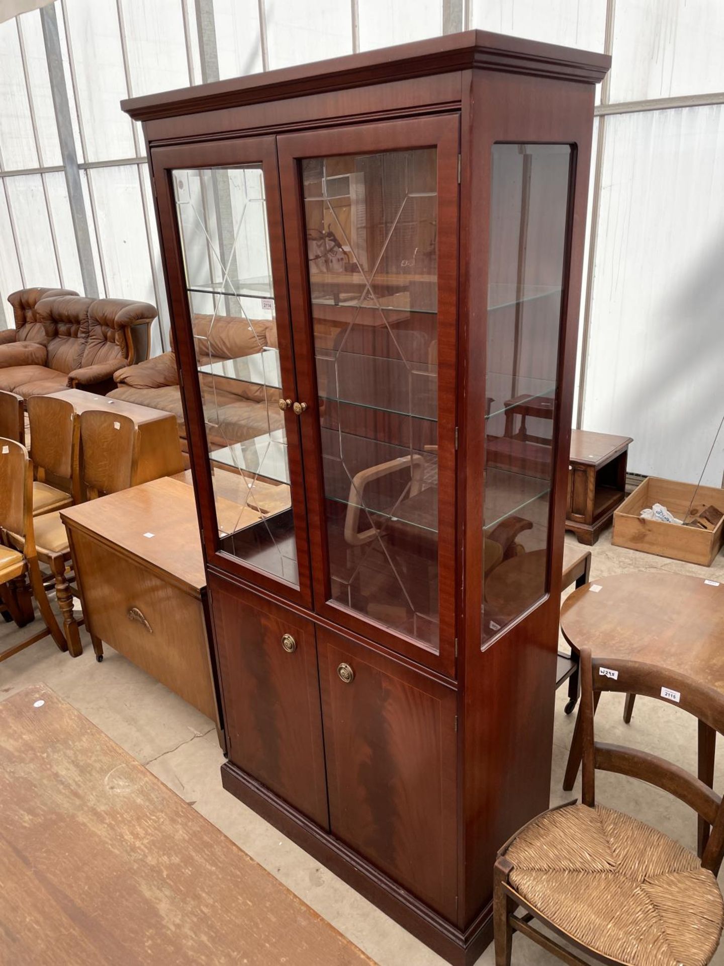 A STAG TWO DOOR GLAZED BOOKCASE ON BASE, 36" WIDE