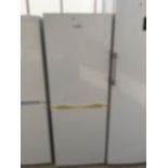 A WHITE NEWWORLD UPRIGHT FRIDGE FREEZER BELIEVED IN WORKING ORDER BUT NO WARRANTY