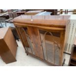 A SHINY WALNUT EARLY 20TH CENTURY CHINA CABINET ON CABRIOLE LEGS, 41.5" WIDE